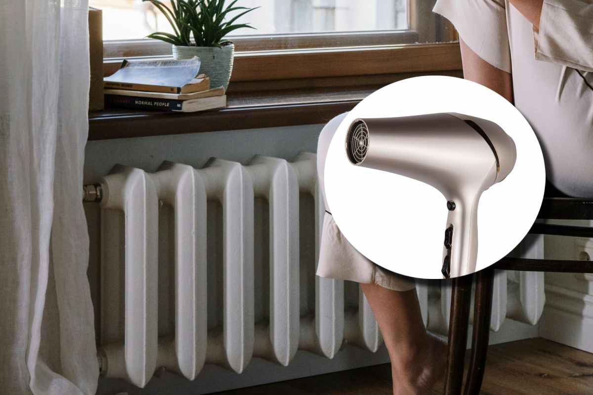 Un termosifone in una stanza e, in evidenza, un phon