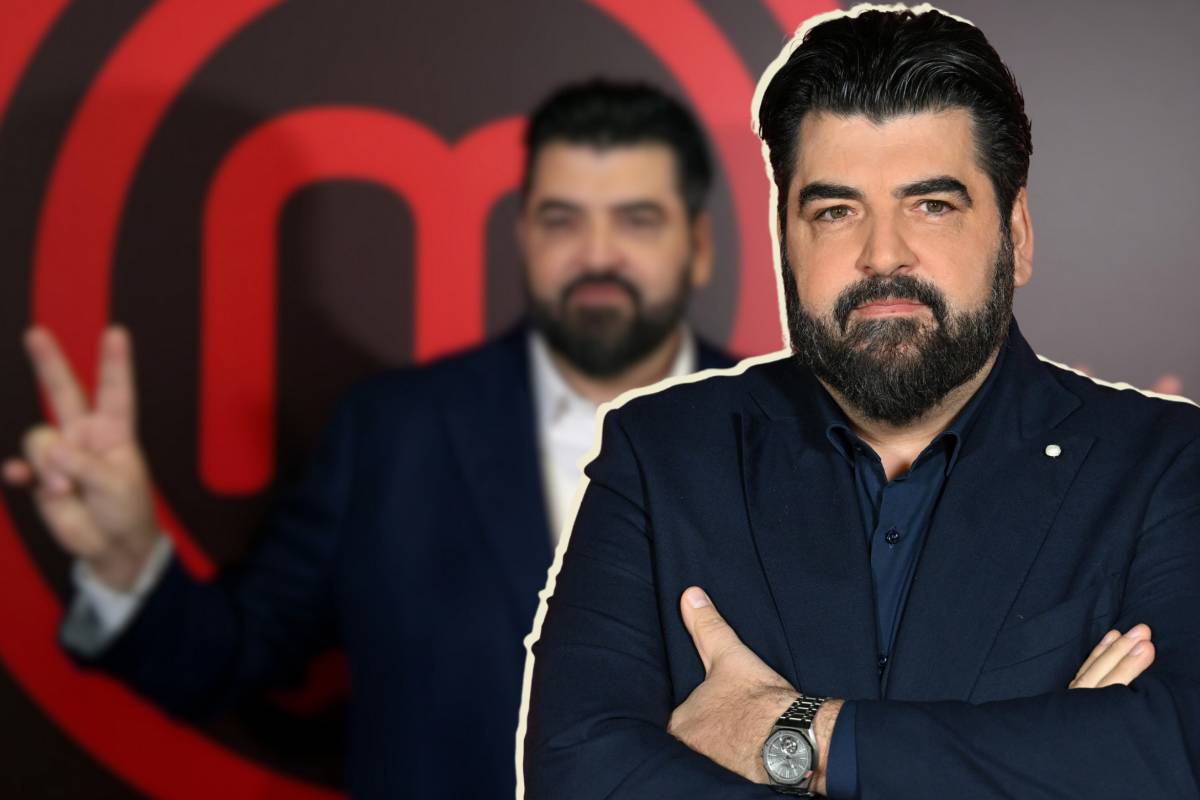 Antonino Cannavacciuolo a braccia conserte su sfondo sfocato