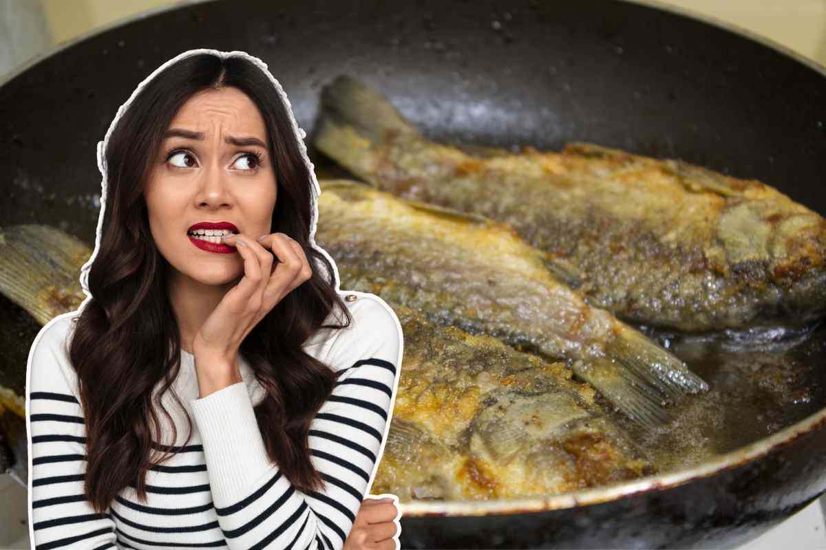 pesce in padella e ragazza pensierosa